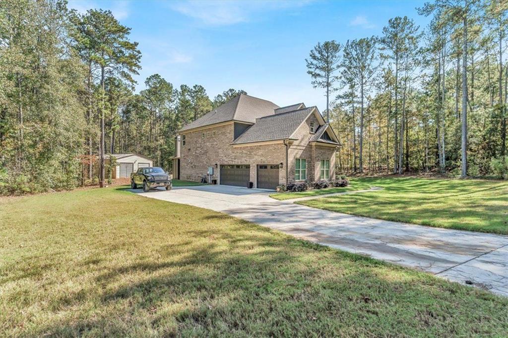 590 Eskew Road McDonough, GA 30252 - Photo 3 of 59 a front view of a house with a yard