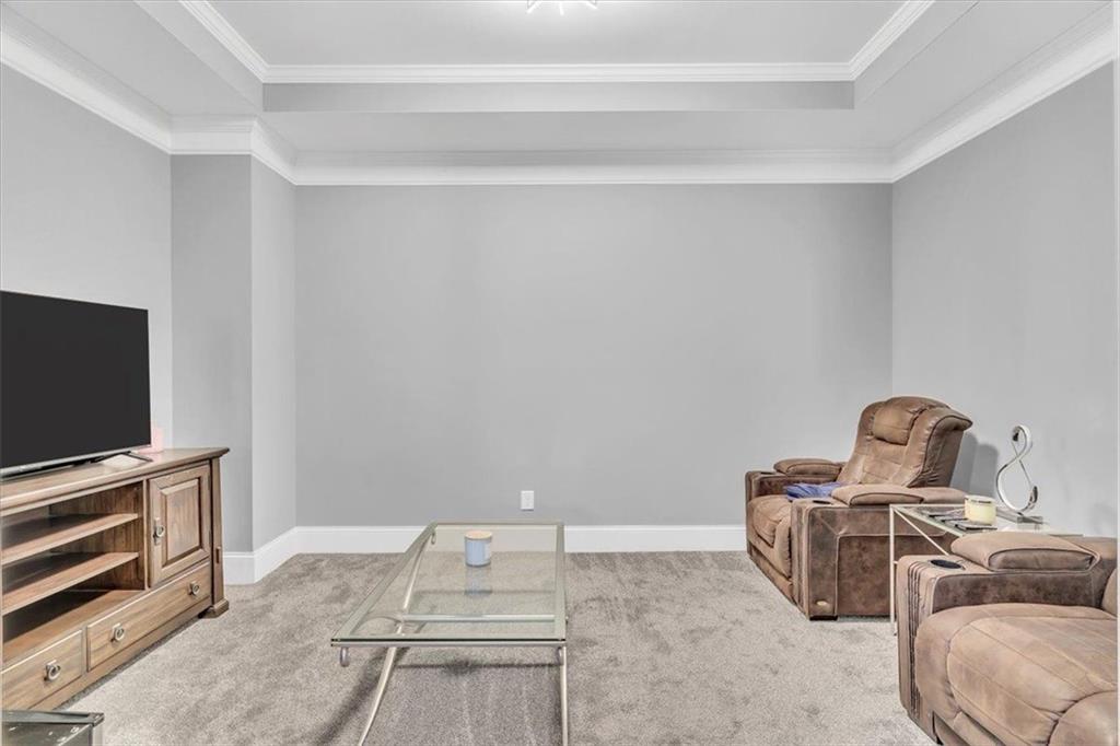 590 Eskew Road McDonough, GA 30252 - Photo 34 of 59 a bedroom with furniture and a flat screen tv