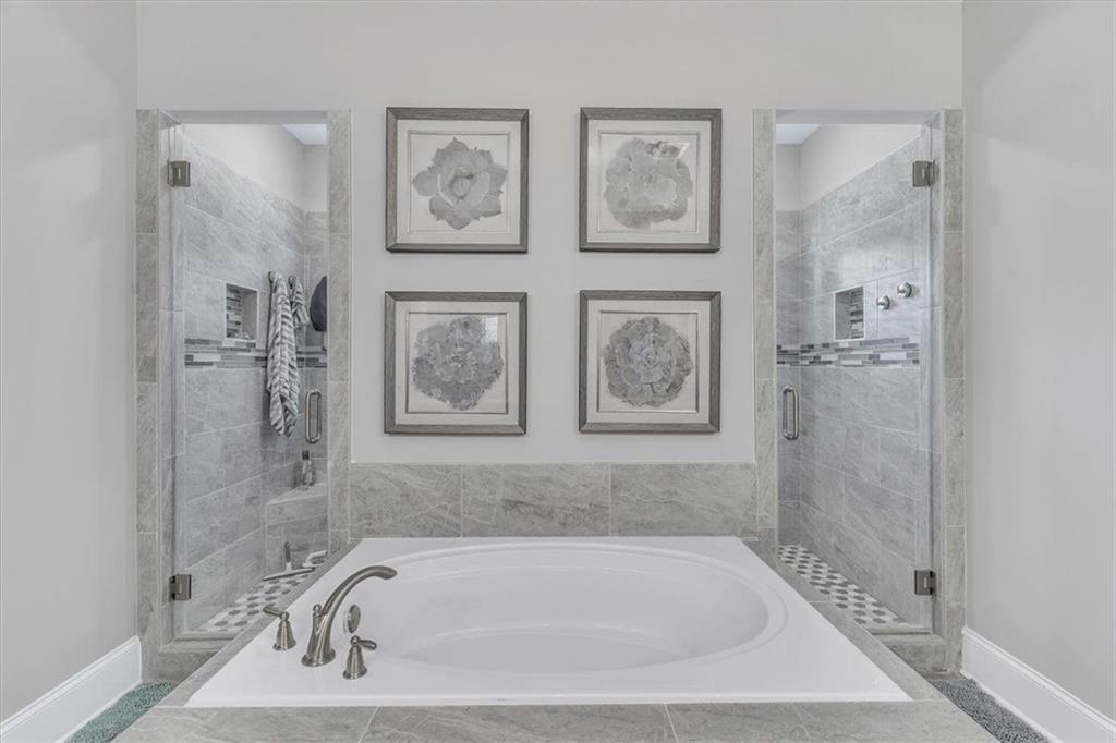 590 Eskew Road McDonough, GA 30252 - Photo 36 of 59 a bath tub sitting next to a bathroom sink