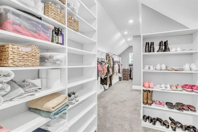 a living room with a fireplace and a floor