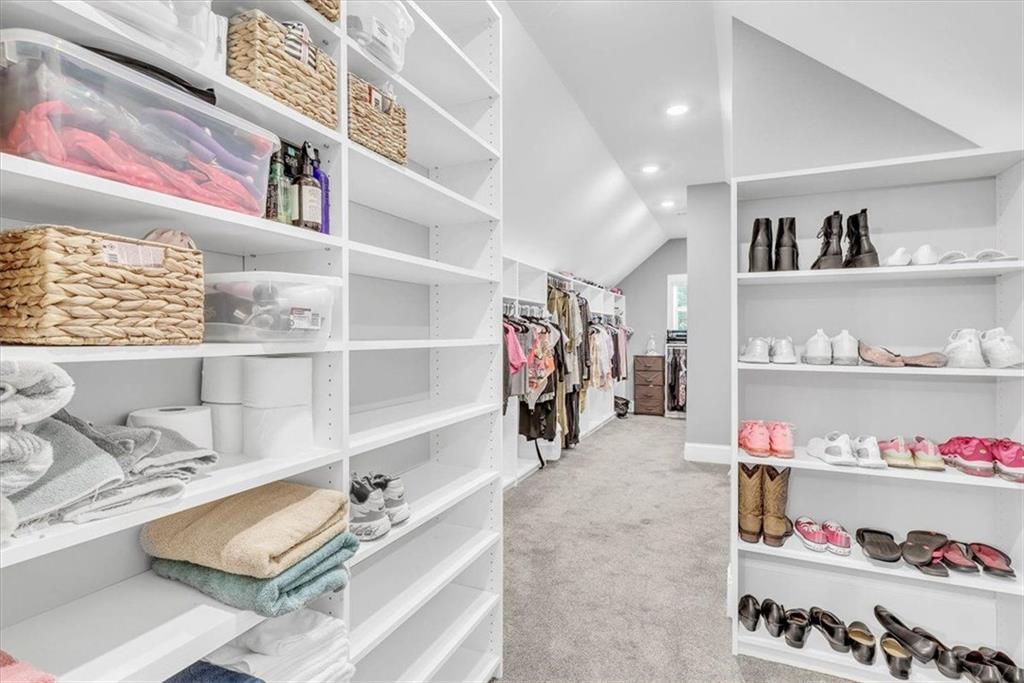 590 Eskew Road McDonough, GA 30252 - Photo 40 of 59 a room with a book shelf and a couch