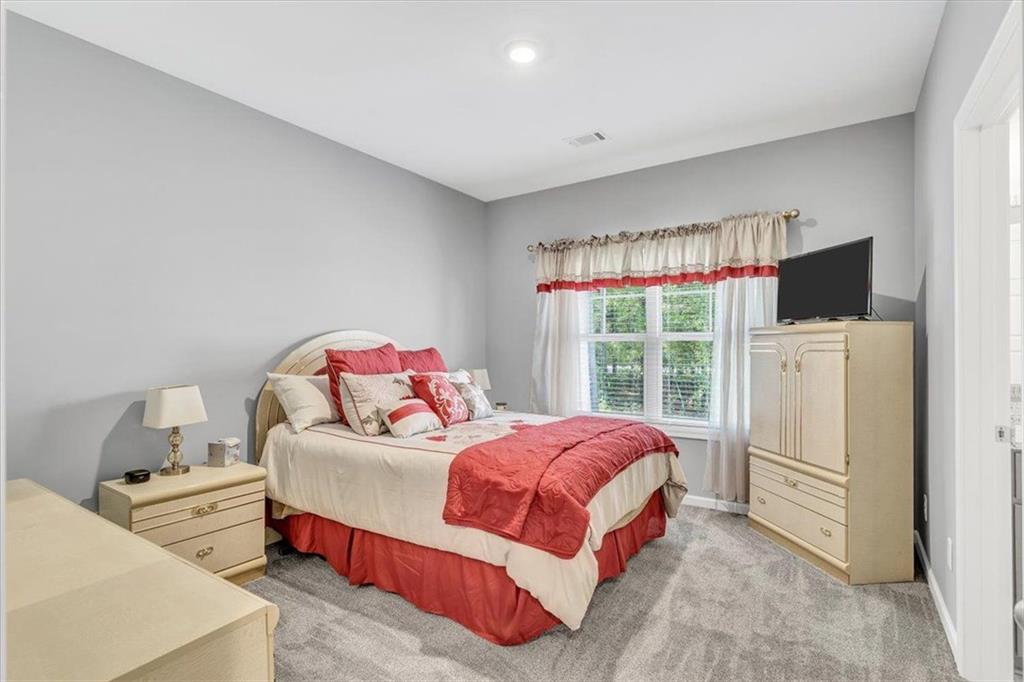 590 Eskew Road McDonough, GA 30252 - Photo 41 of 59 a bedroom with a bed and a window