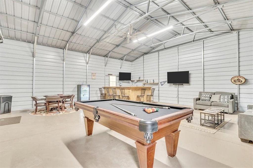 590 Eskew Road McDonough, GA 30252 - Photo 51 of 59 a room with furniture and flat screen tv