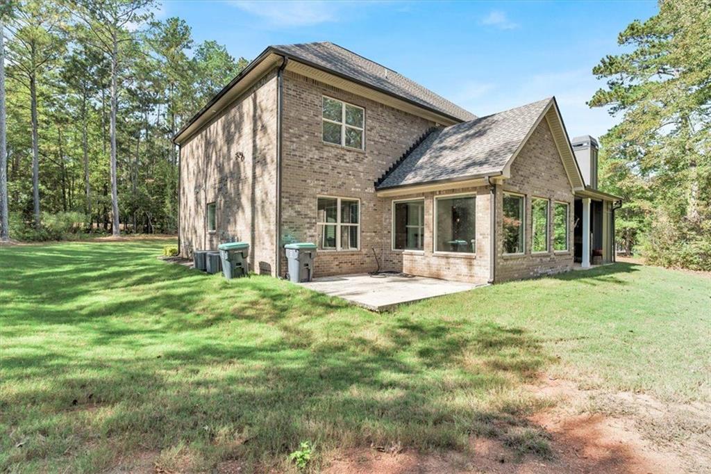 590 Eskew Road McDonough, GA 30252 - Photo 55 of 59 a view of a house with backyard and porch