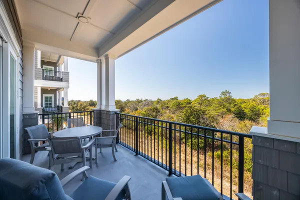 a view of a balcony with chairs