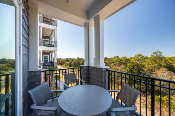 a view of balcony with furniture