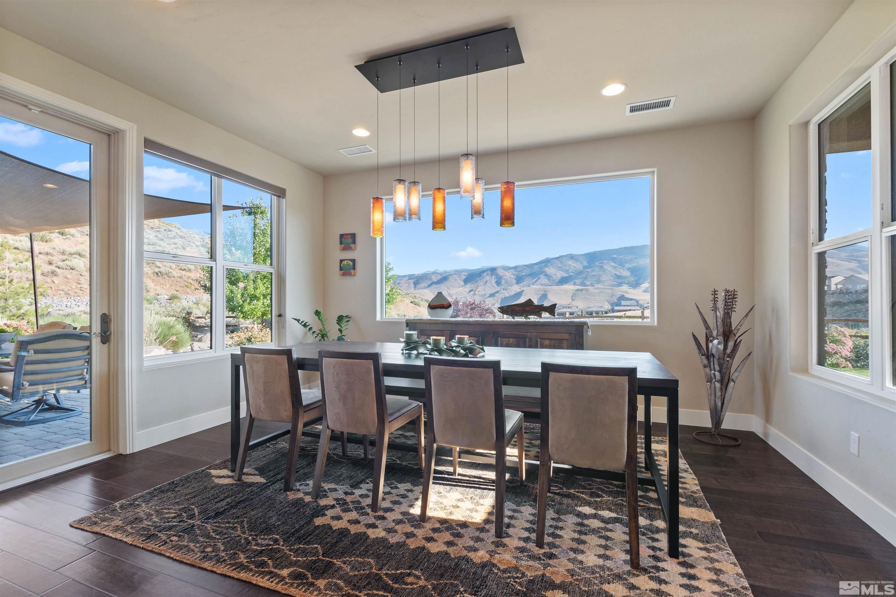 1575 Scott Valley Road Reno, NV 89523 - Photo 13 of 40 a dining room with furniture and wooden floor
