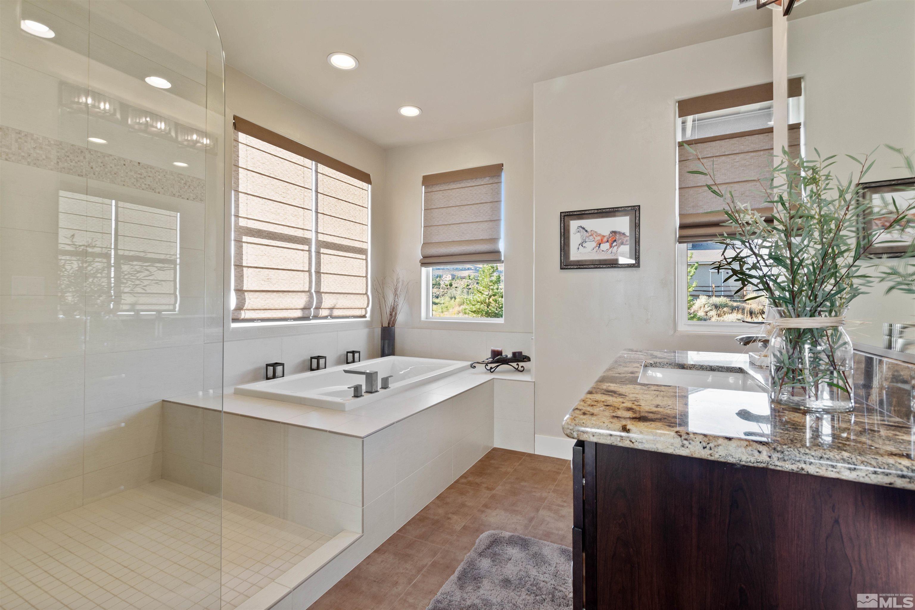 1575 Scott Valley Road Reno, NV 89523 - Photo 21 of 40 a bathroom with a tub sink and window