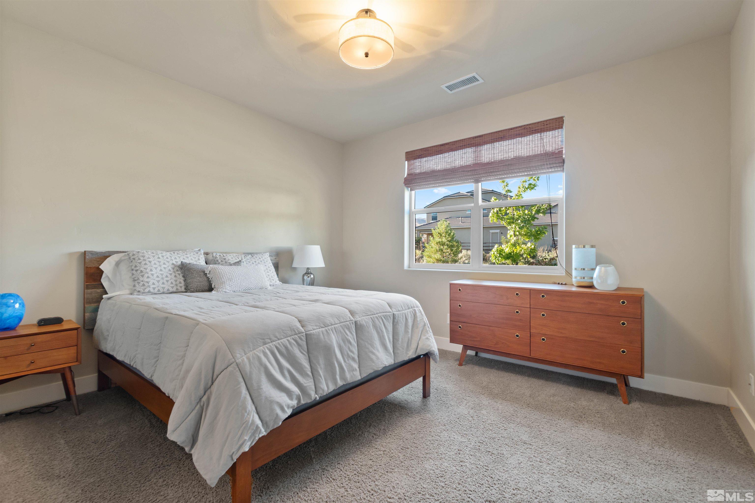 1575 Scott Valley Road Reno, NV 89523 - Photo 22 of 40 a bed room with a bed and a window