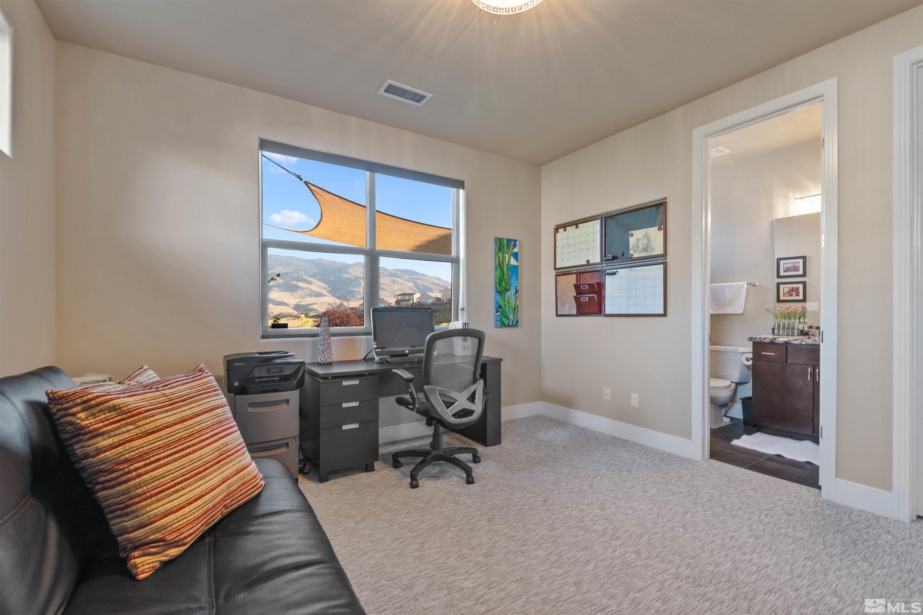 1575 Scott Valley Road Reno, NV 89523 - Photo 25 of 40 a view of a workspace with furniture and a window