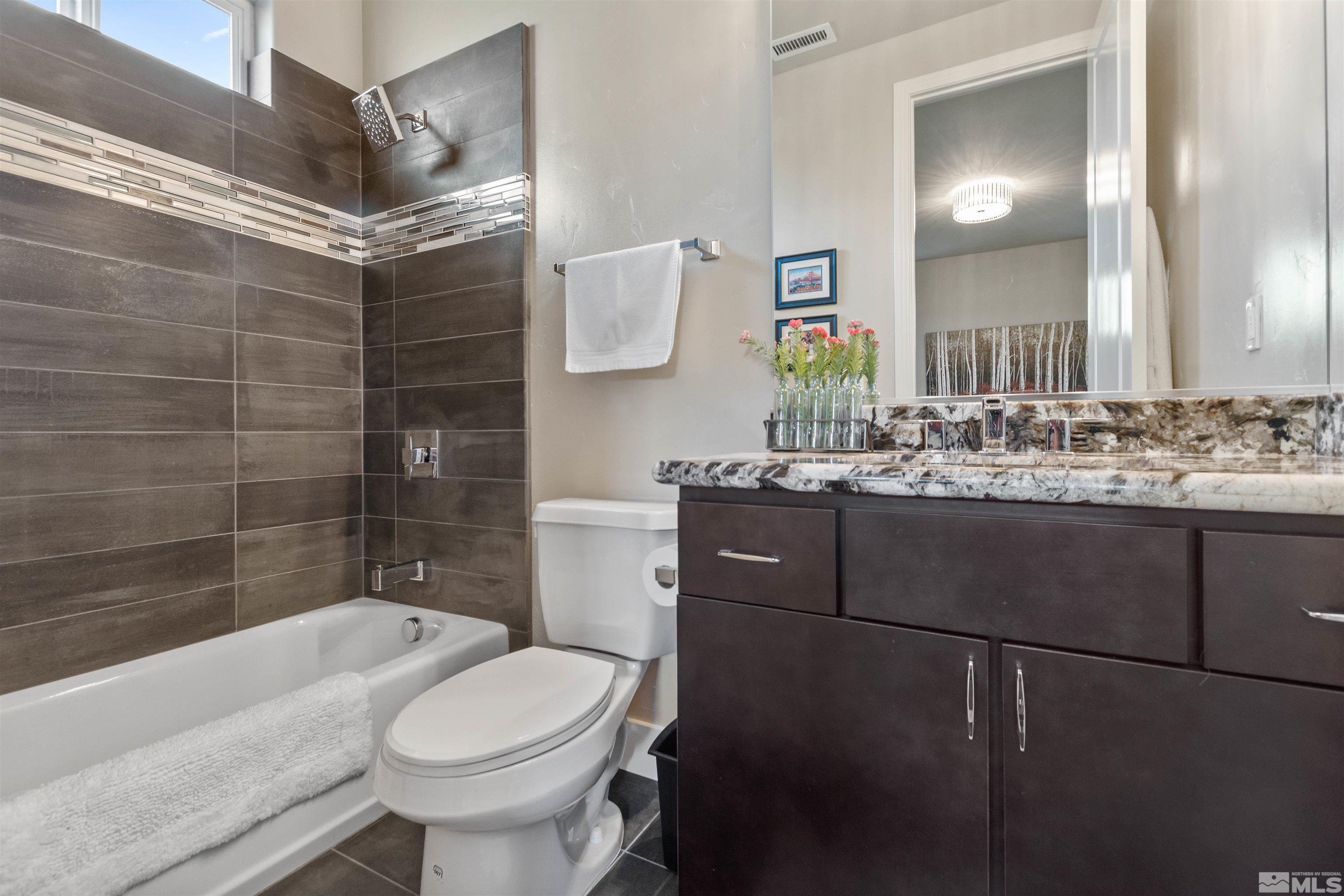 1575 Scott Valley Road Reno, NV 89523 - Photo 26 of 40 a bathroom with a sink toilet and shower