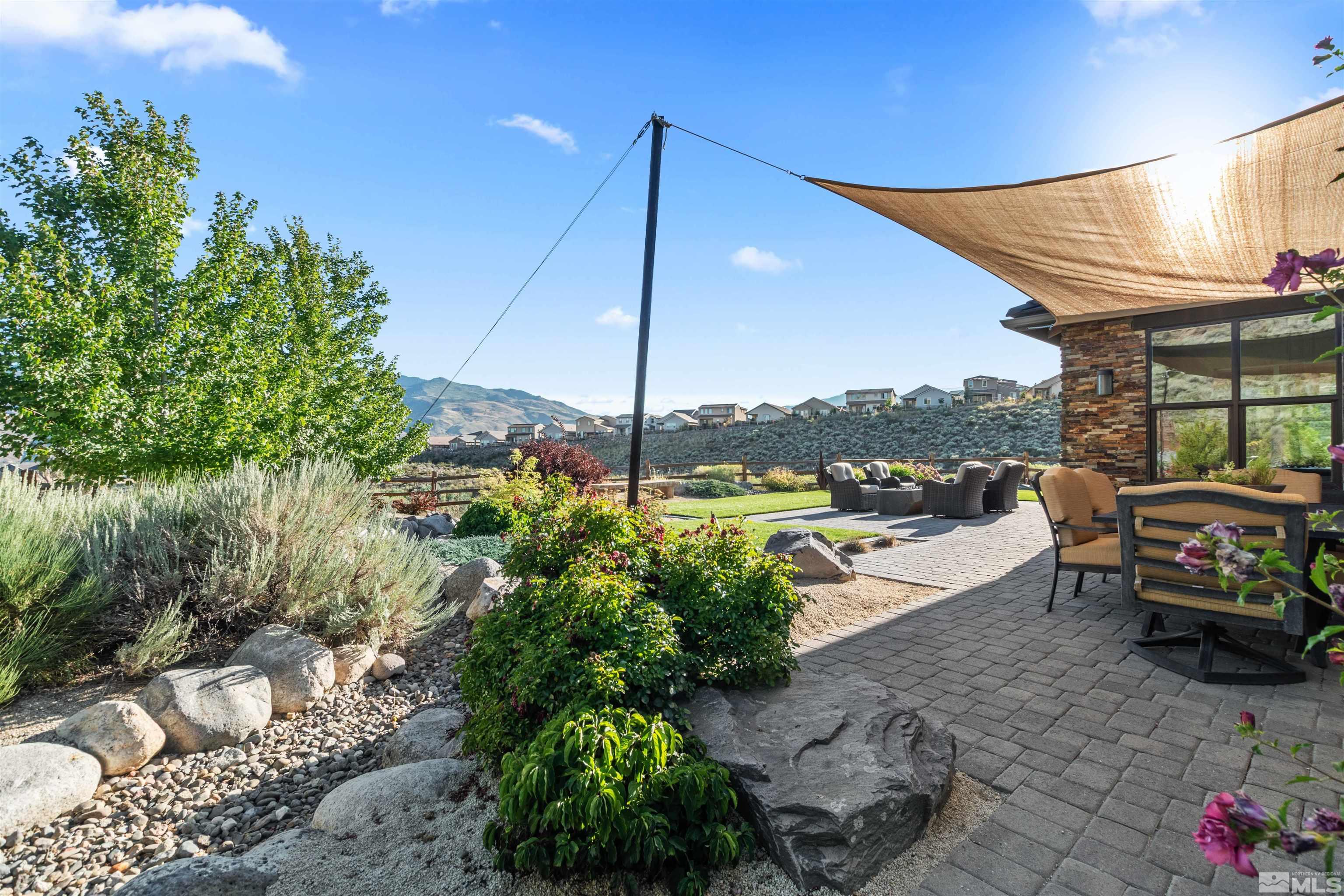 1575 Scott Valley Road Reno, NV 89523 - Photo 30 of 40 a backyard of a house with a yard and outdoor seating