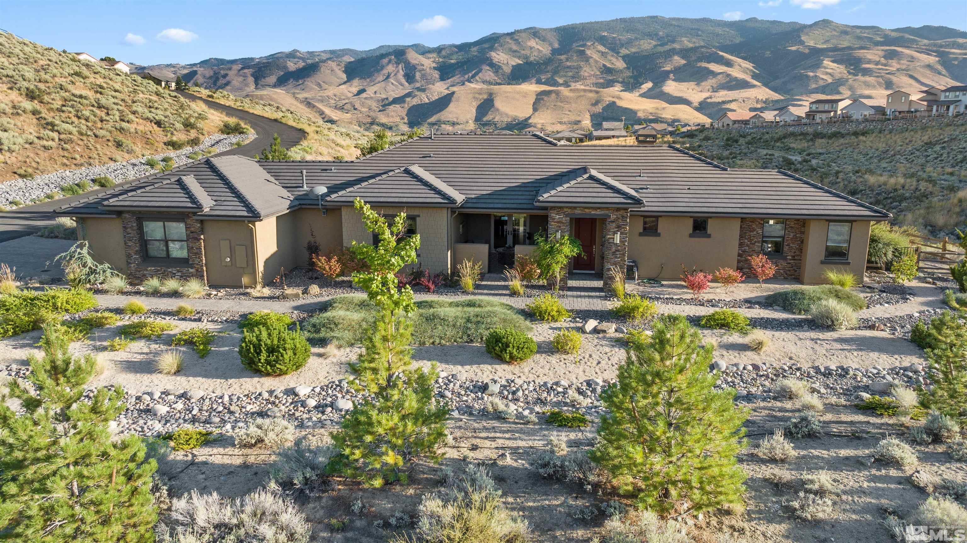 1575 Scott Valley Road Reno, NV 89523 - Photo 3 of 40 a front view of a house with garden