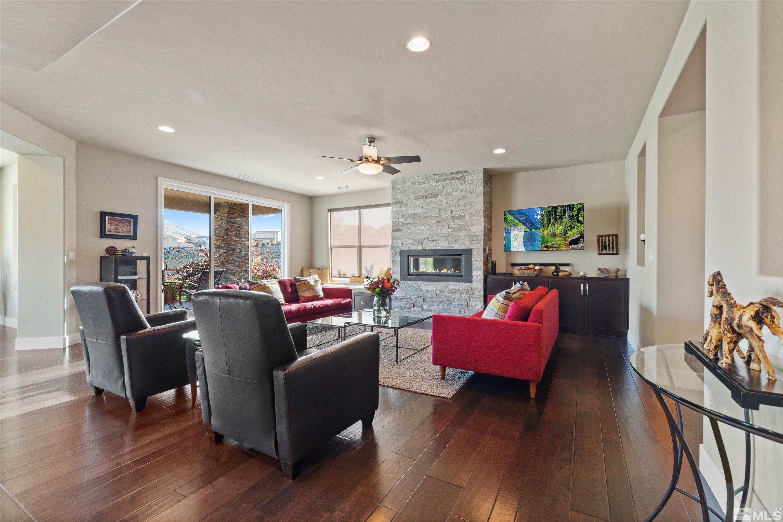 1575 Scott Valley Road Reno, NV 89523 - Photo 8 of 40 a living room with furniture flat screen tv and a fireplace