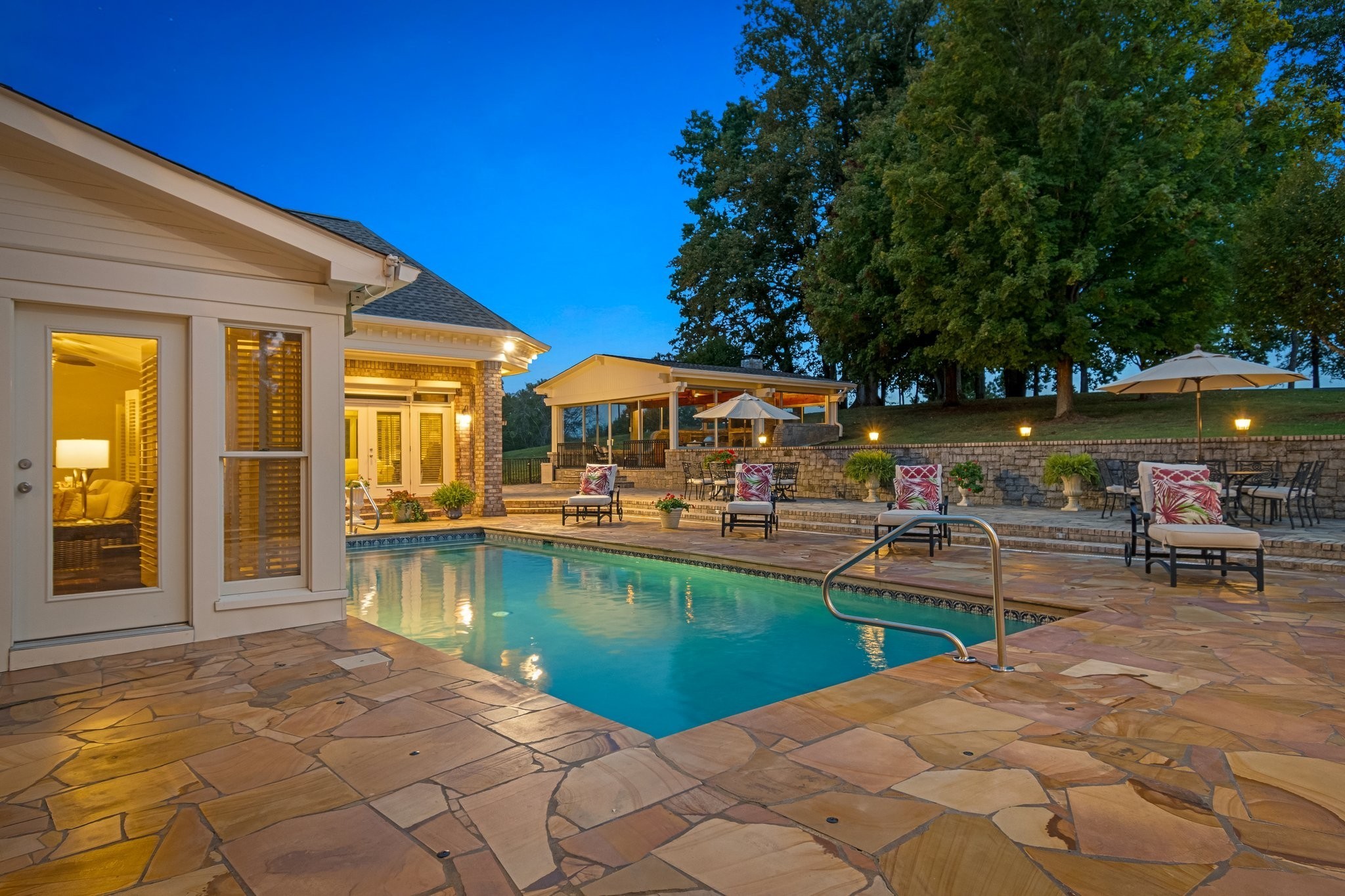 4025 Nestledown Drive Franklin, TN 37067 - Photo 28 of 57 a view of a swimming pool with chairs and table in the patio