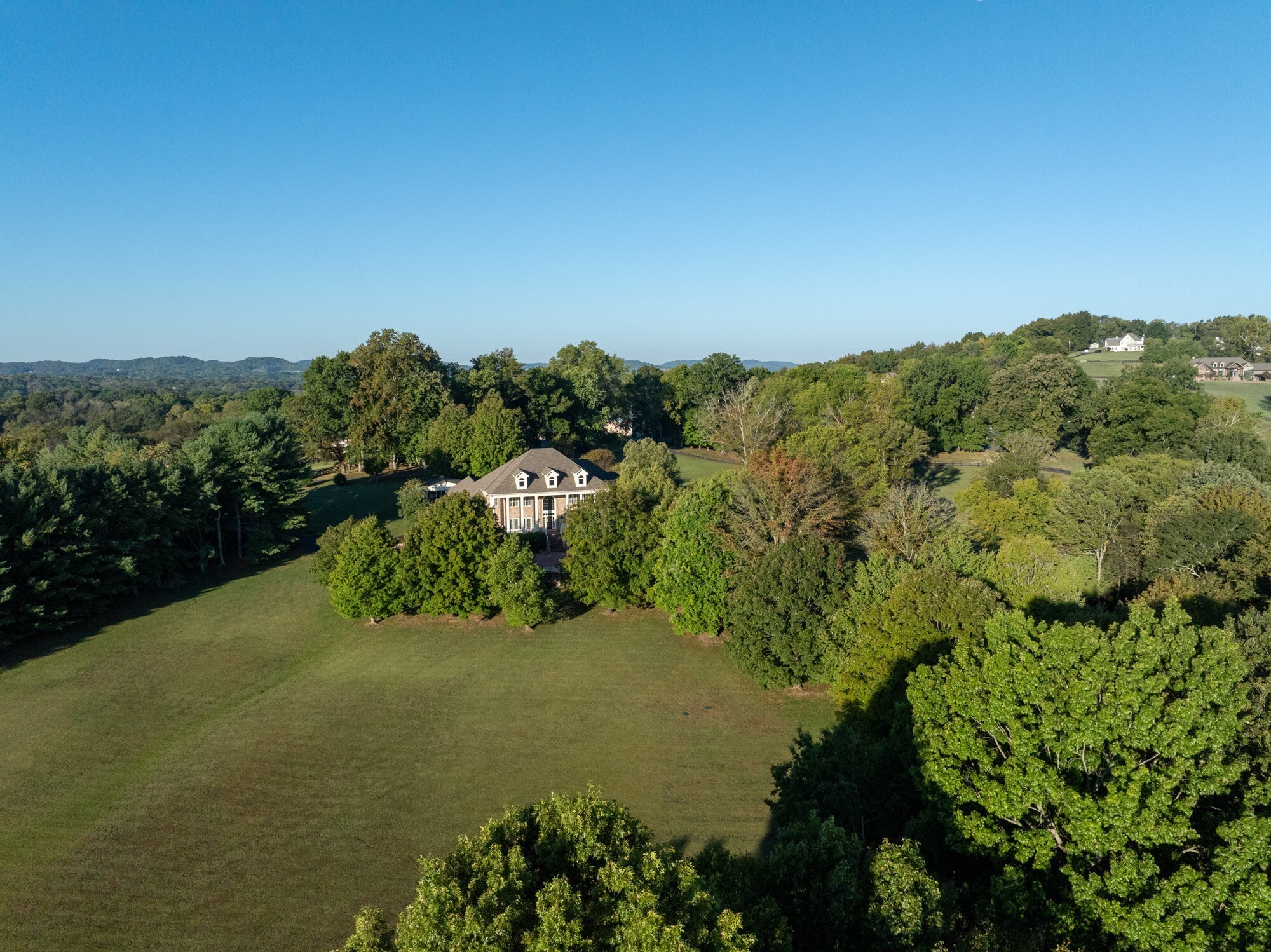 4025 Nestledown Drive Franklin, TN 37067 - Photo 51 of 57 a view of a lake with a mountain in the background