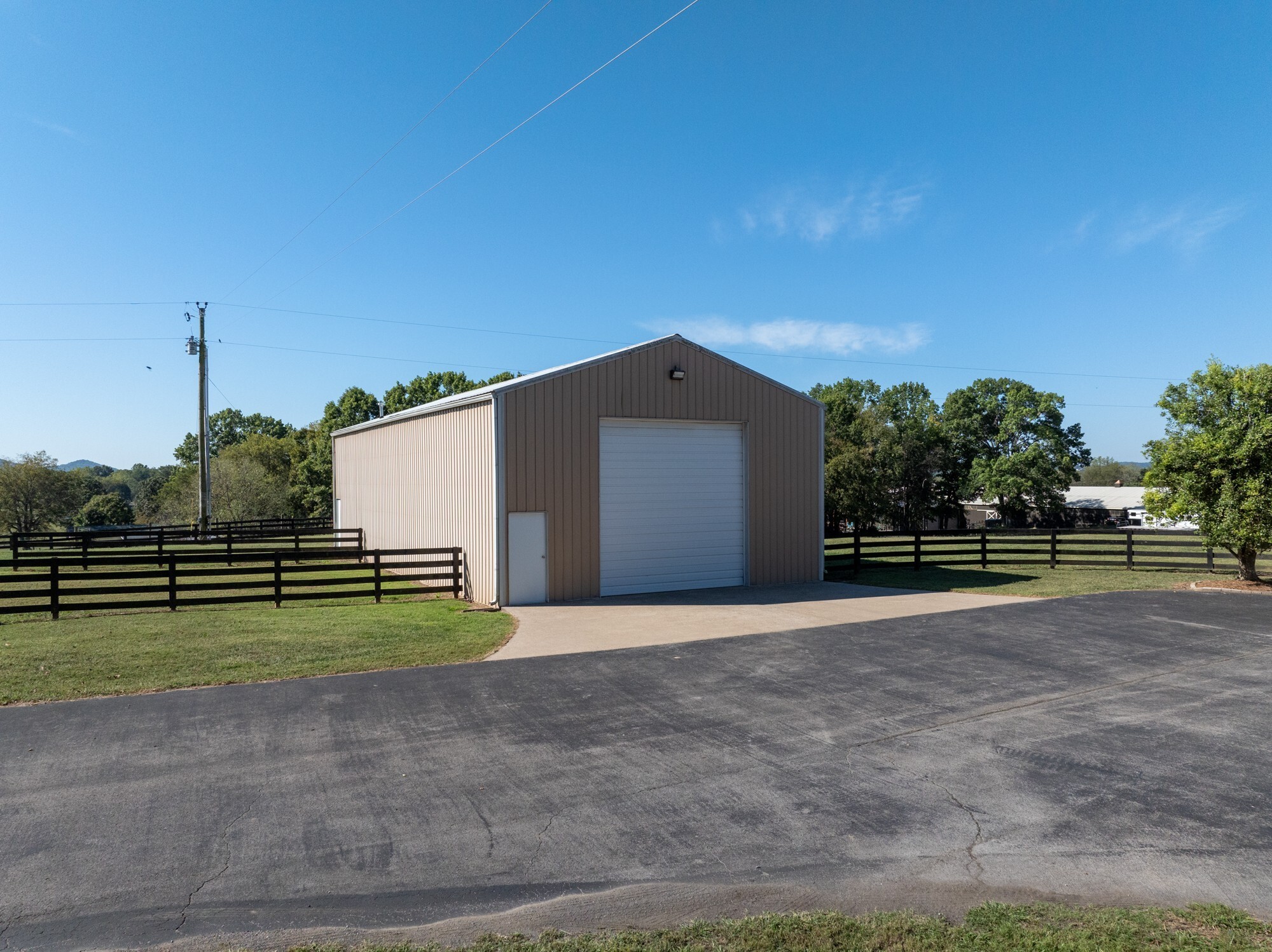 4025 Nestledown Drive Franklin, TN 37067 - Photo 55 of 57 a view of a big house with a big yard and large trees
