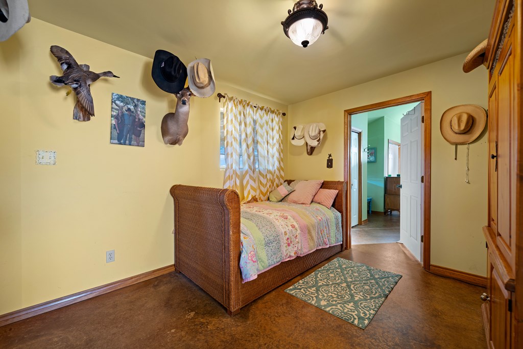 917 Bear Springs Road Mason, TX 76856 - Photo 31 of 38 a bedroom with a bed and dresser