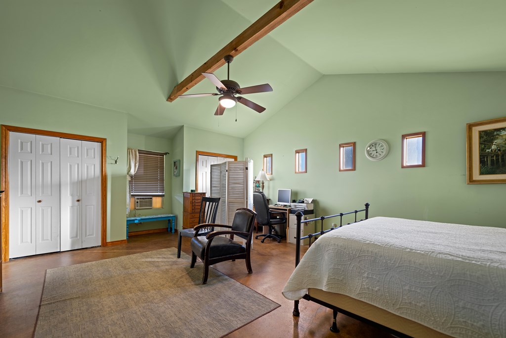 917 Bear Springs Road Mason, TX 76856 - Photo 35 of 38 a bedroom with furniture and a ceiling fan