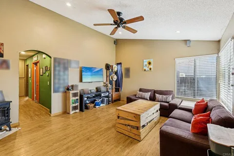 a living room with furniture and a flat screen tv