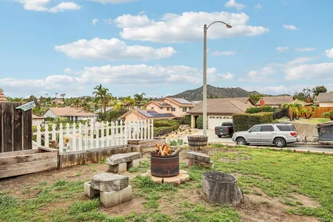 an aerial view of residential houses with city view