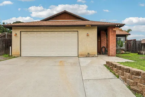 an aerial view of a house with a garden