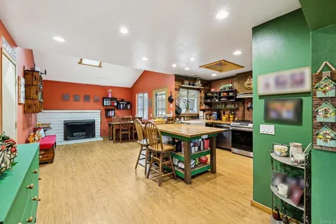 a view of a dining room with furniture and a table