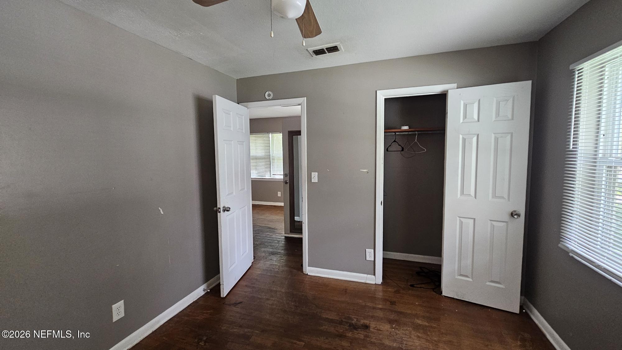 2727 North N Davis Rd Street Jacksonville, FL 32206 - Photo 12 of 31 an empty room with closet and a window