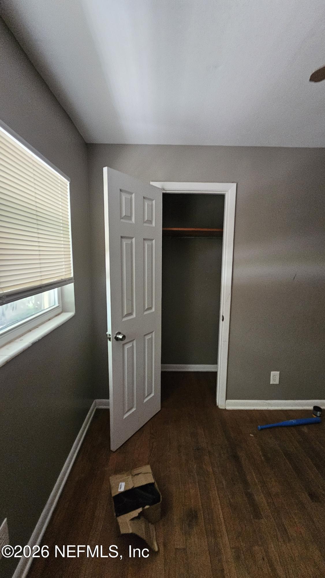 2727 North N Davis Rd Street Jacksonville, FL 32206 - Photo 28 of 31 an empty room with wooden floor and windows