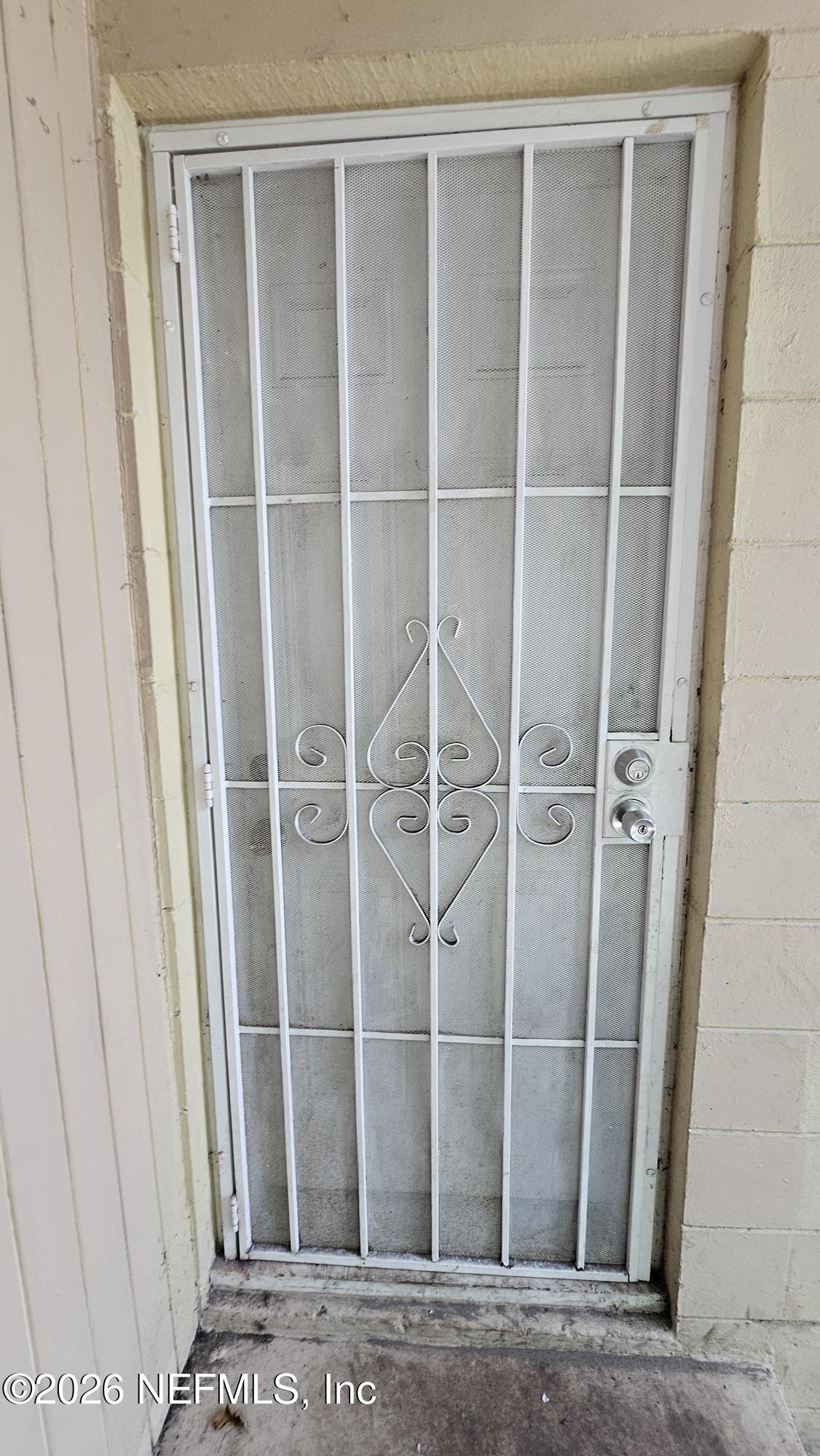 2727 North N Davis Rd Street Jacksonville, FL 32206 - Photo 4 of 31 a view of a room with a wooden door