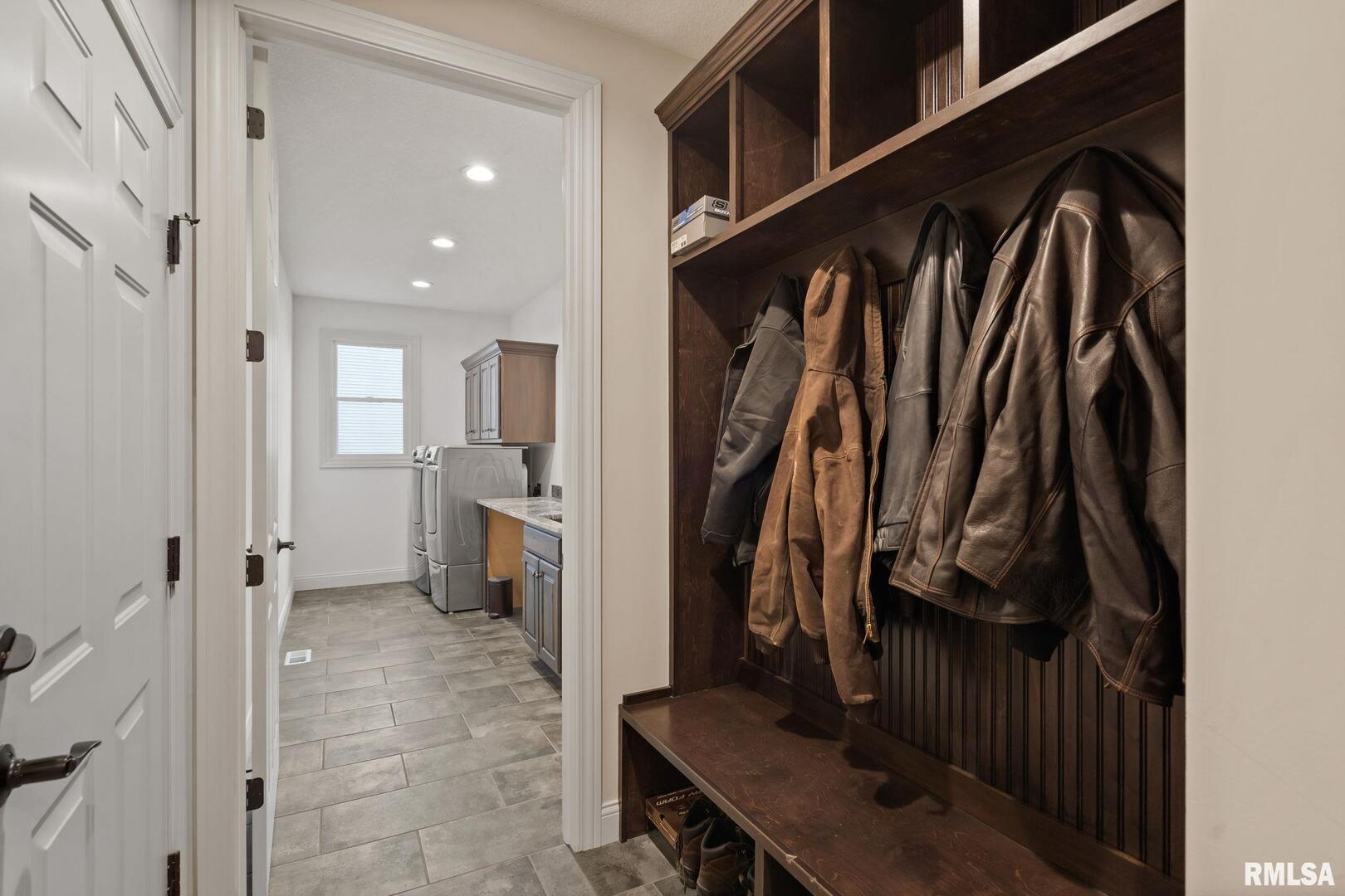 1422 Racine Court Davenport, IA 52804 - Photo 28 of 53 a view of walk in closet with clothes and shoes