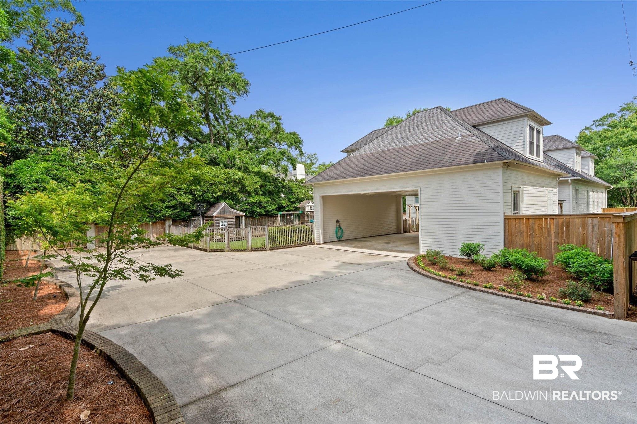 3813 Austill Lane Mobile, AL 36608 - Photo 23 of 37 Spacious concrete driveway offering extensive parking and access to a two-car carport