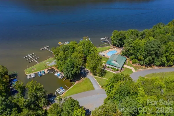 an aerial view of a house with a yard and garden