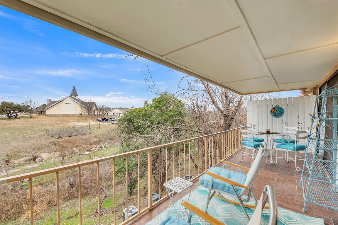 1201 Ranch Road 1431, Unit 8 Marble Falls, TX 78654 - Photo 20 of 24 Long covered Balcony with plenty of space for furniture.