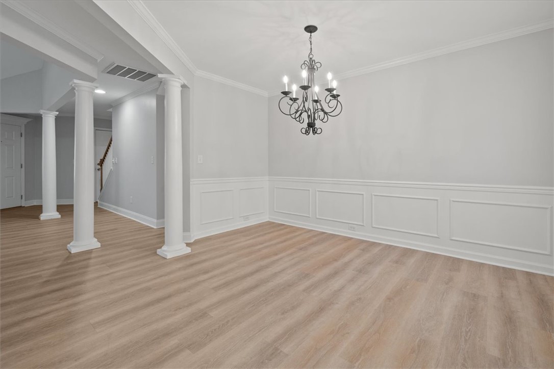 100 Shipyard Circle Anderson, SC 29621 - Photo 9 of 40 This dining room features elegant wainscoting and warm wood flooring, ready for your personal touch.