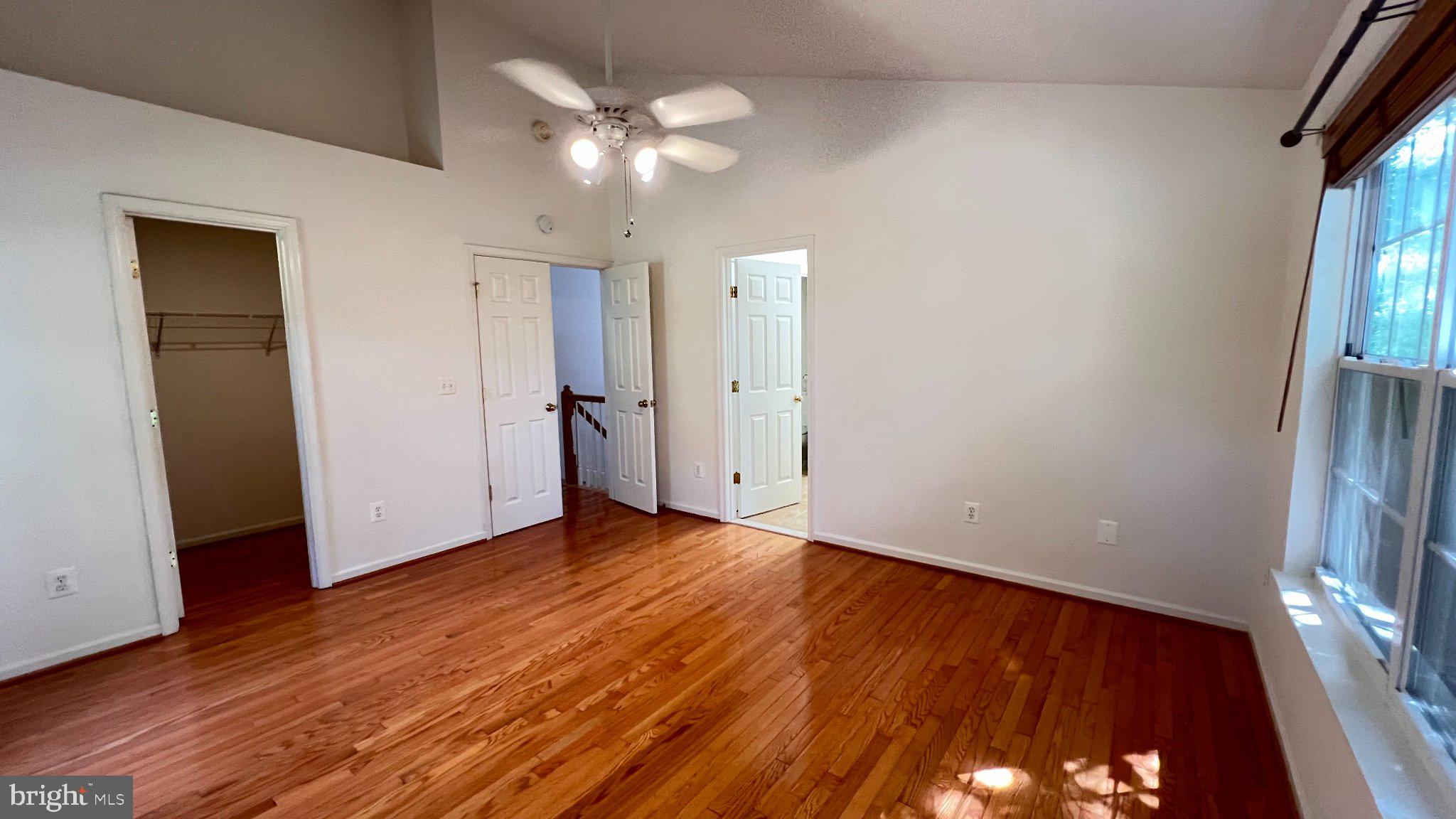 4100 Flower Fairfax, VA 22030 - Photo 22 of 47 a view of an empty room with wooden floor and a window