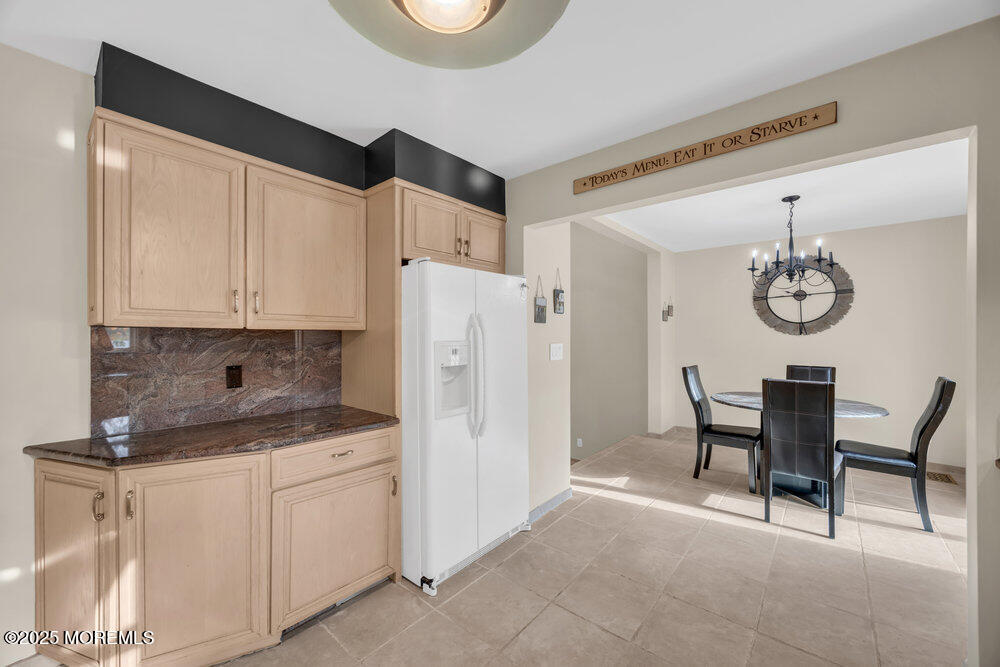 46 Owens Road Old Bridge, NJ 08857 - Photo 13 of 26 a kitchen with a white cabinets and chairs