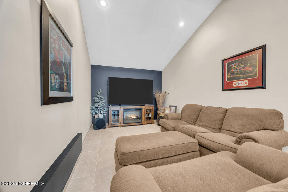 46 Owens Road Old Bridge, NJ 08857 - Photo 8 of 26 a living room with furniture and a flat screen tv