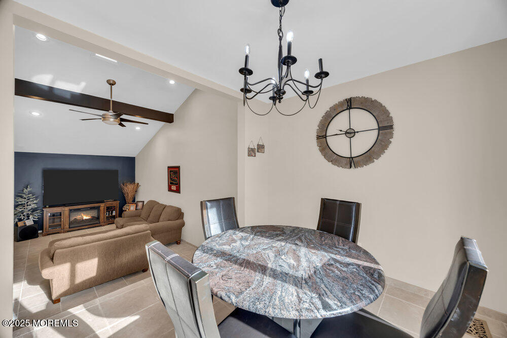 46 Owens Road Old Bridge, NJ 08857 - Photo 10 of 26 a bedroom with a bed and a chandelier