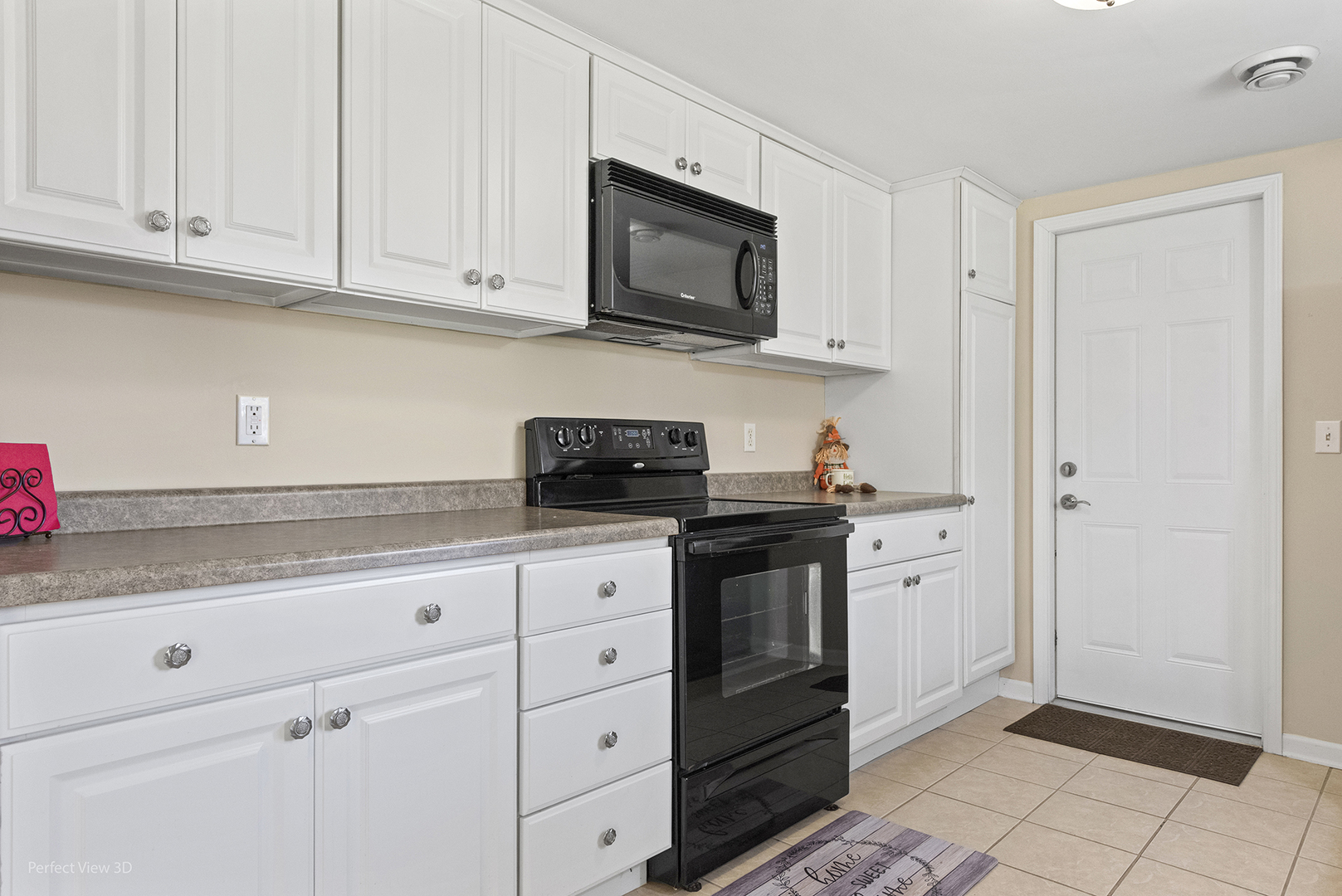 1505 North Kankakee Street Wilmington, IL 60481 - Photo 5 of 7 a kitchen with stainless steel appliances granite countertop white cabinets and sink
