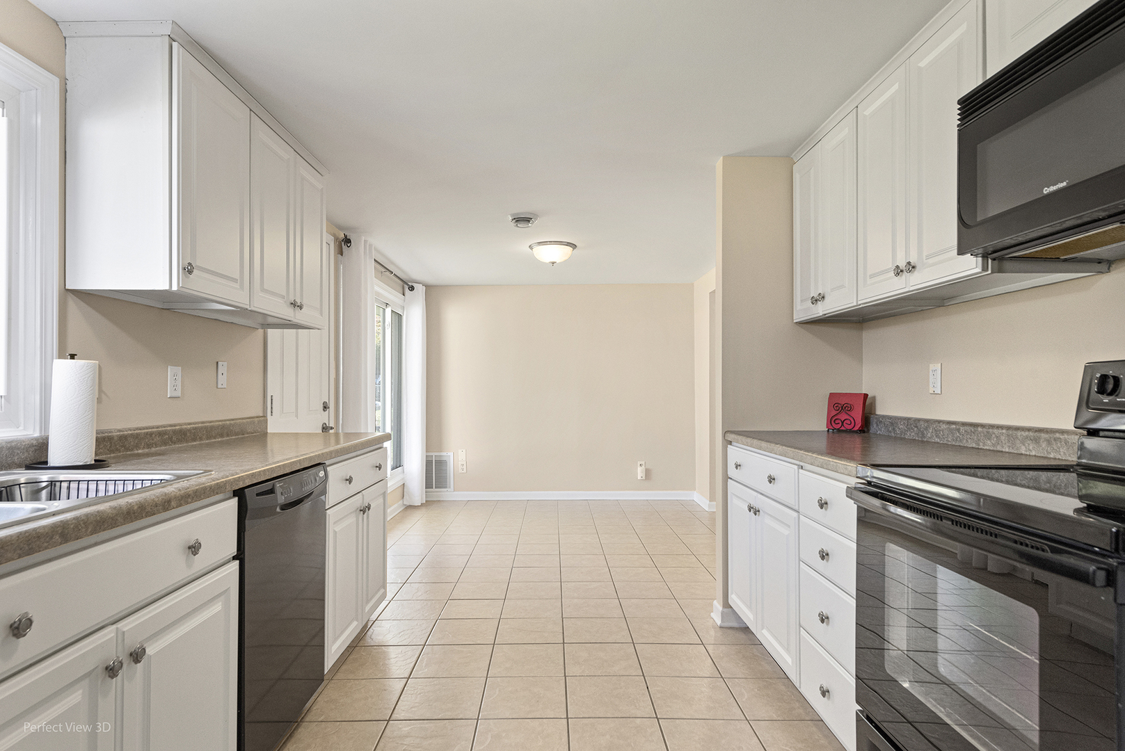 1505 North Kankakee Street Wilmington, IL 60481 - Photo 7 of 7 a kitchen with stainless steel appliances granite countertop a sink and cabinets