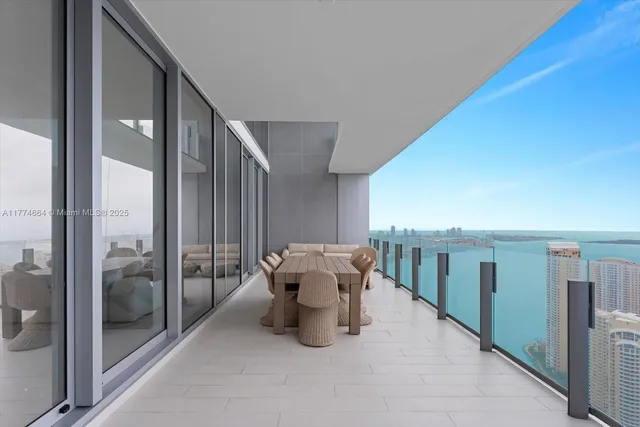 a view of a hallway with seating area