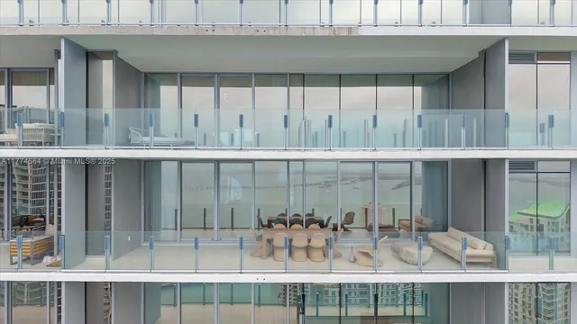 a view of a wooden table and chairs in the room