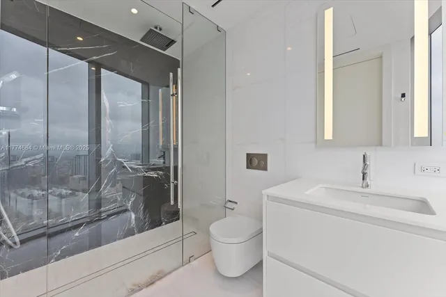 a spacious bedroom with a bed and a couch