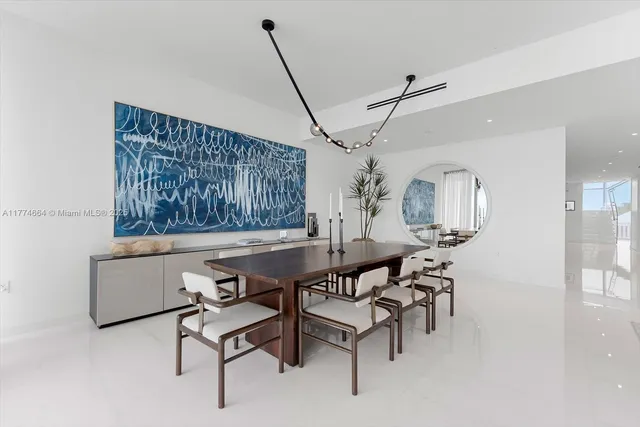 a view of a room with furniture and wooden floor