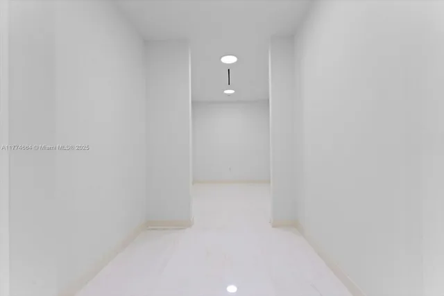 a view of a bathroom with a sink and a window