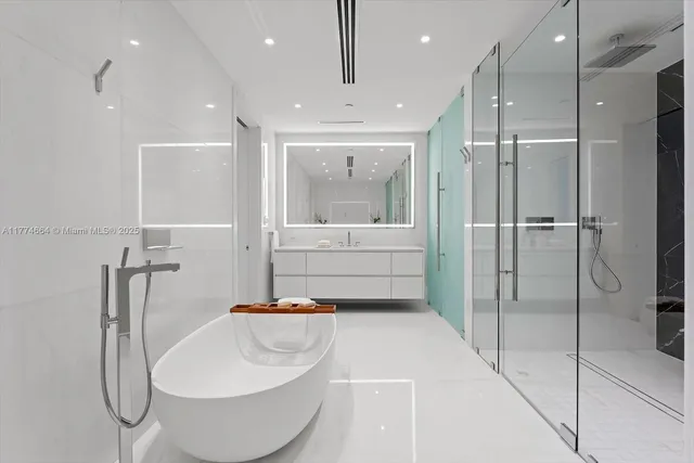a bathroom with a sink and shower