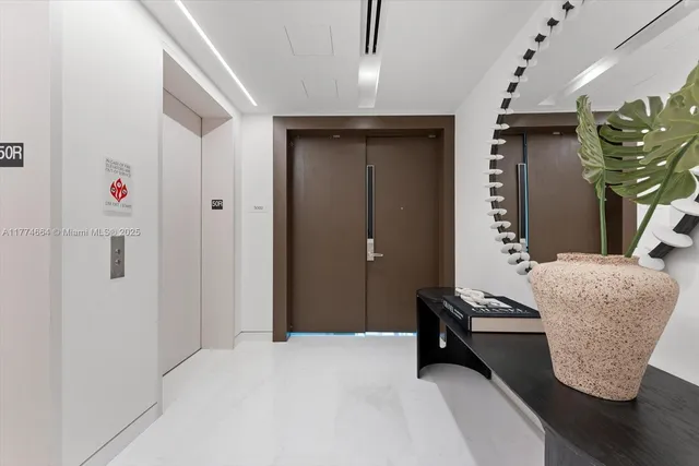 a bedroom with furniture and a potted plant