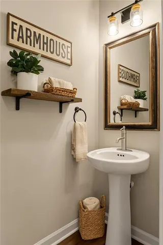 a bathroom with a sink a mirror and vanity