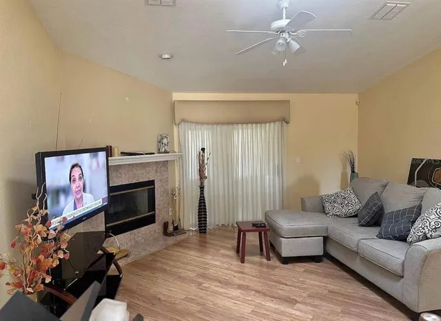 a living room with furniture and a fireplace